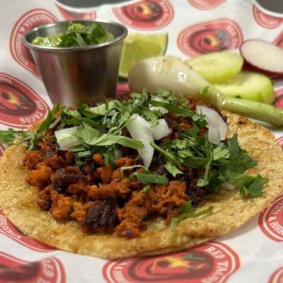 Red Tacos' variety of authentic-flavored tacos: al pastor, asada, chicken, chorizo, carnitas, and sesina, appealingly presented in Indianapolis.