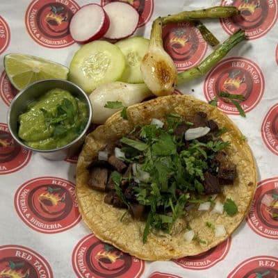 Red Tacos' variety of authentic-flavored tacos: al pastor, asada, chicken, chorizo, carnitas, and sesina, appealingly presented in Indianapolis.
