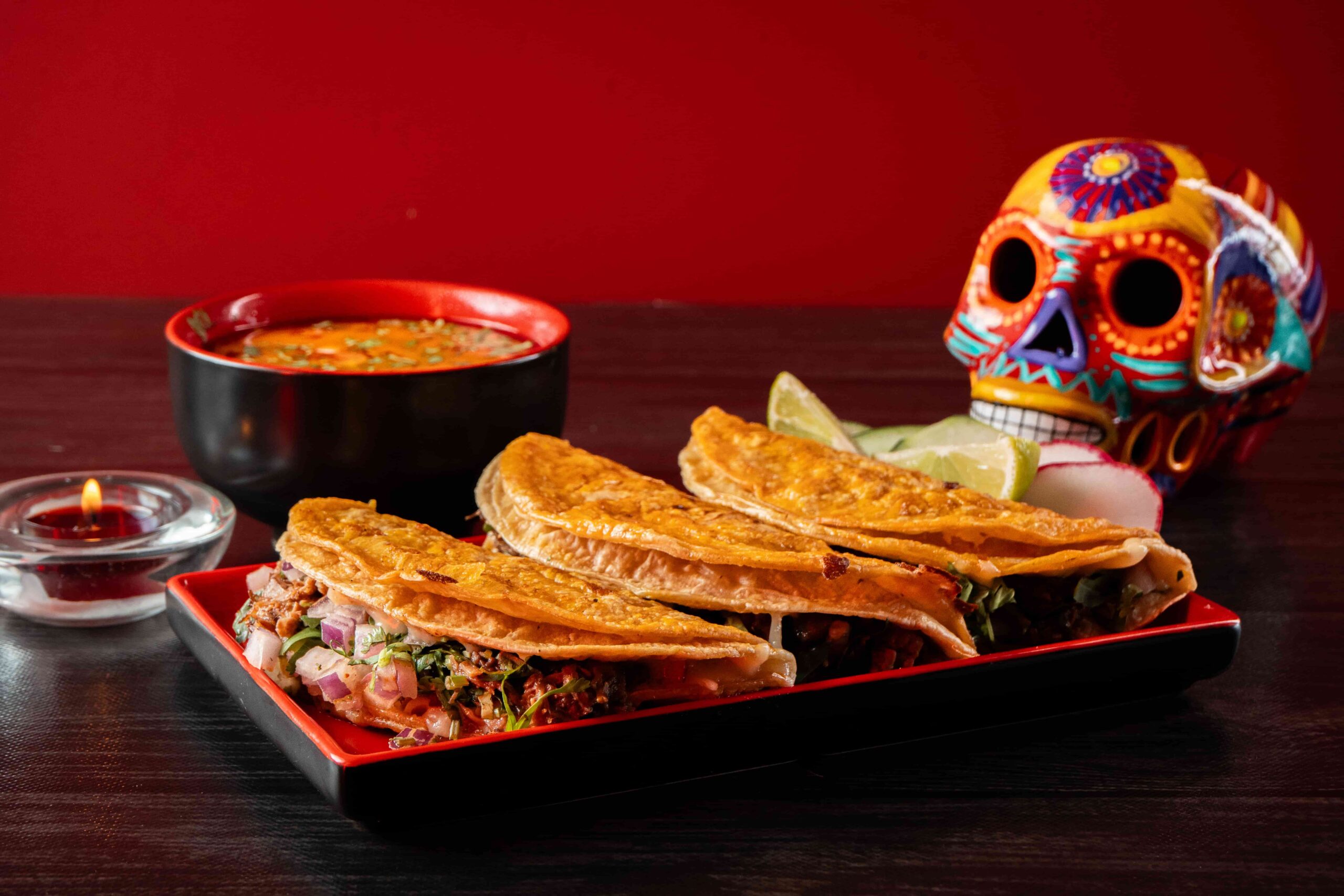 Tijuana-style birria tacos with consommé